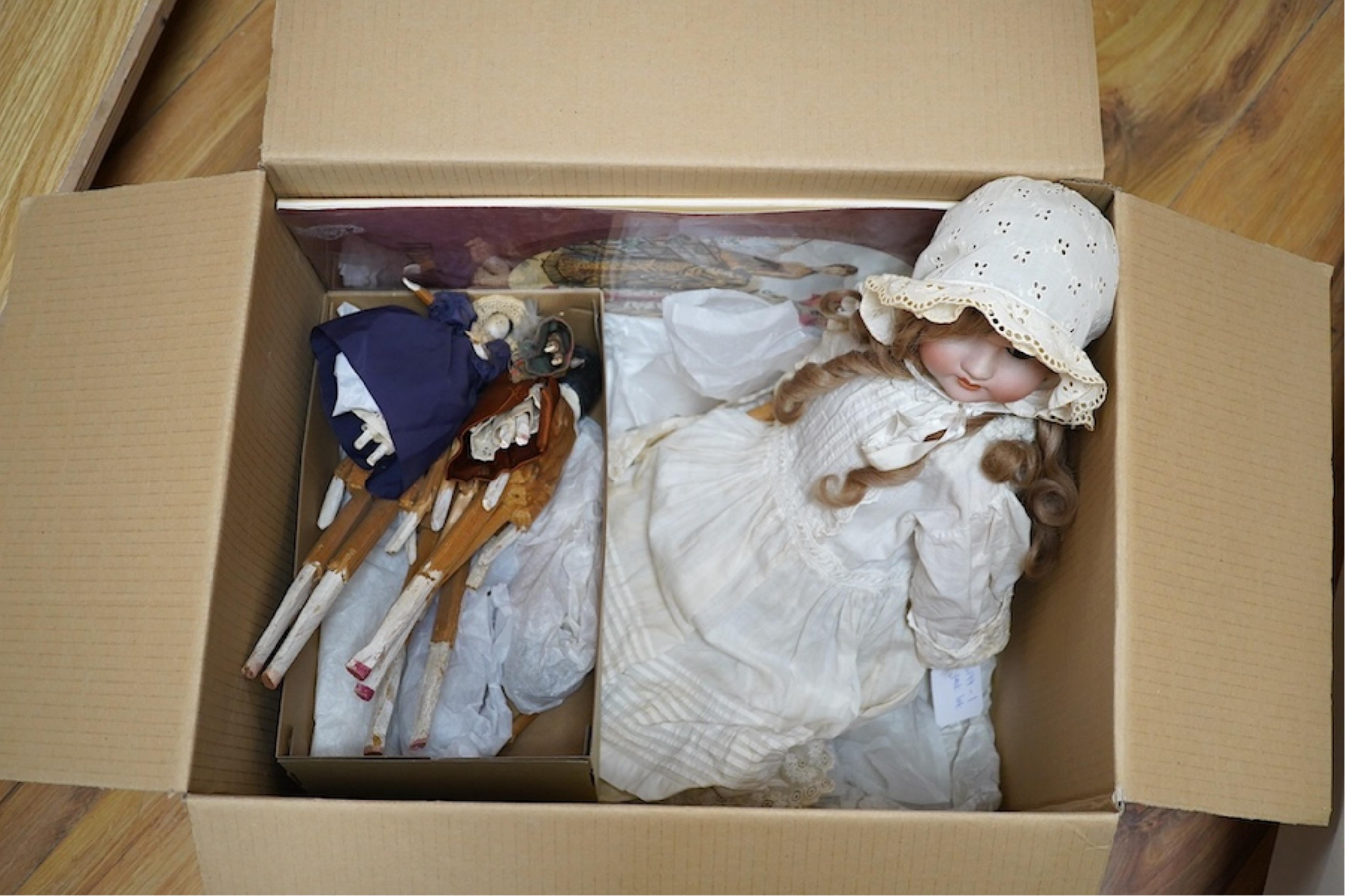 A Max Handwerck doll, jointed body, vintage clothes, 60cm high, one finger broken, together with a collection of eleven peg wooden dolls, 10cm to 30.5cm high, together with modern fashion plates (13). Condition - fair
